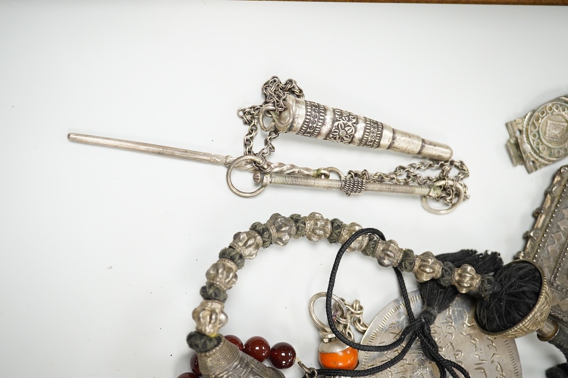 A collection of Bedouin white metal, gilt metal, lapis lazuli mounted jewellery, etc. from Oman